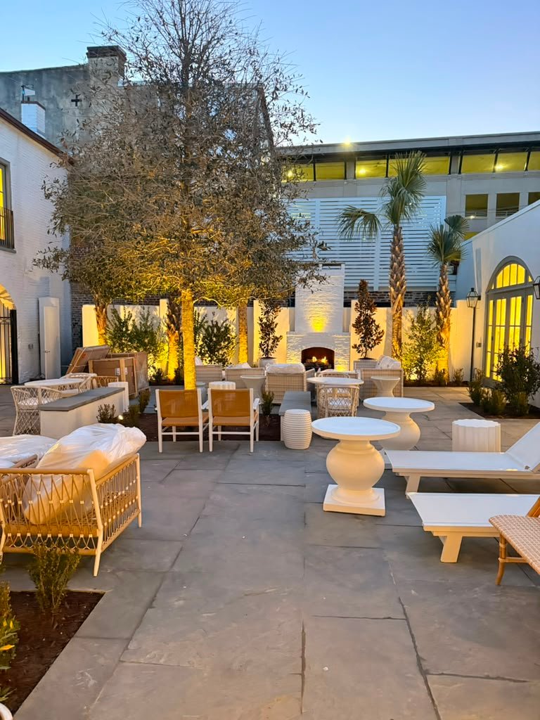 Custom landscaped outdoor living space with stone patio